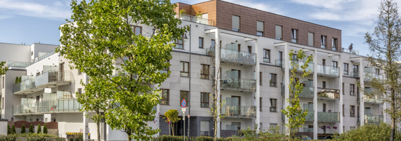 Modern complex of white apartment buildings, Warsaw